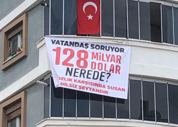 MHP’li isim balkonuna 128 milyar nerede pankartı astı